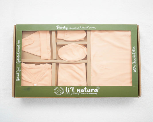 Box of wooden play food pieces with 'Li'l natura' branding on a white background